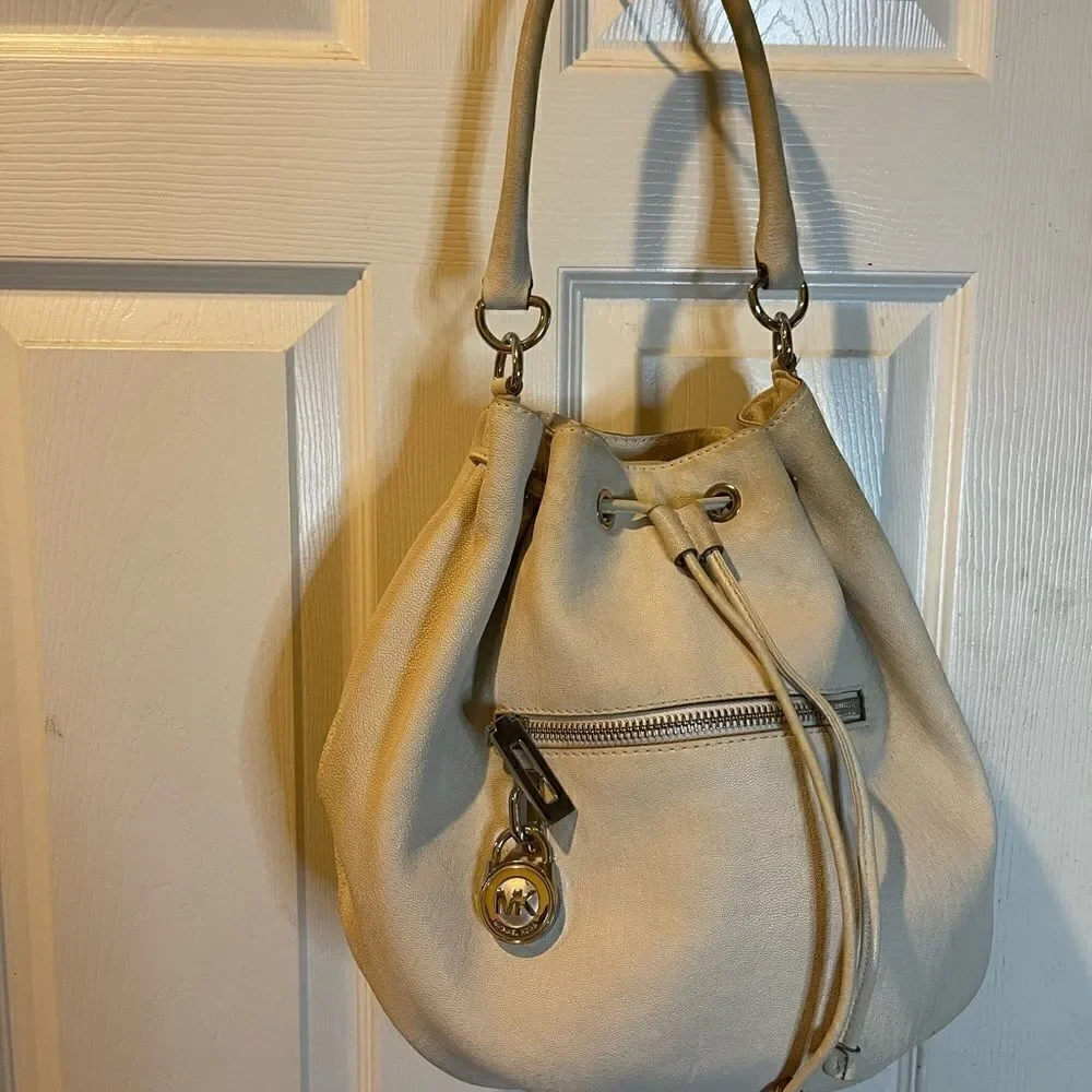 Michael Michael Kors leather beige drawstring bucket satchel.silver tone accents